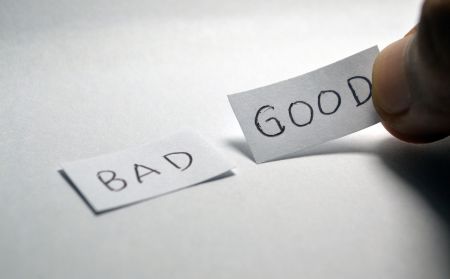 good and bad written on paper