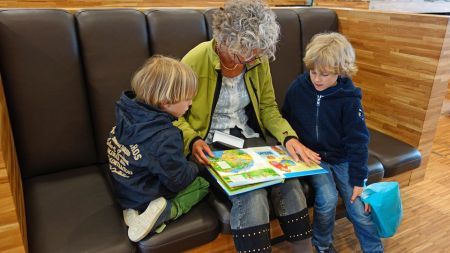 women reading story to kids
