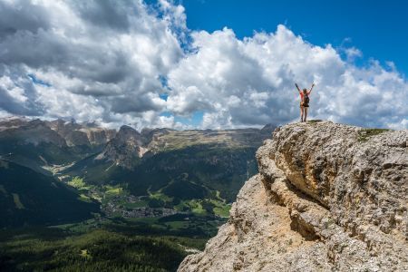 woman standing on cliff