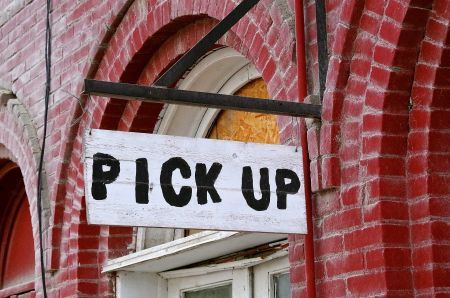 sign that reads pick up