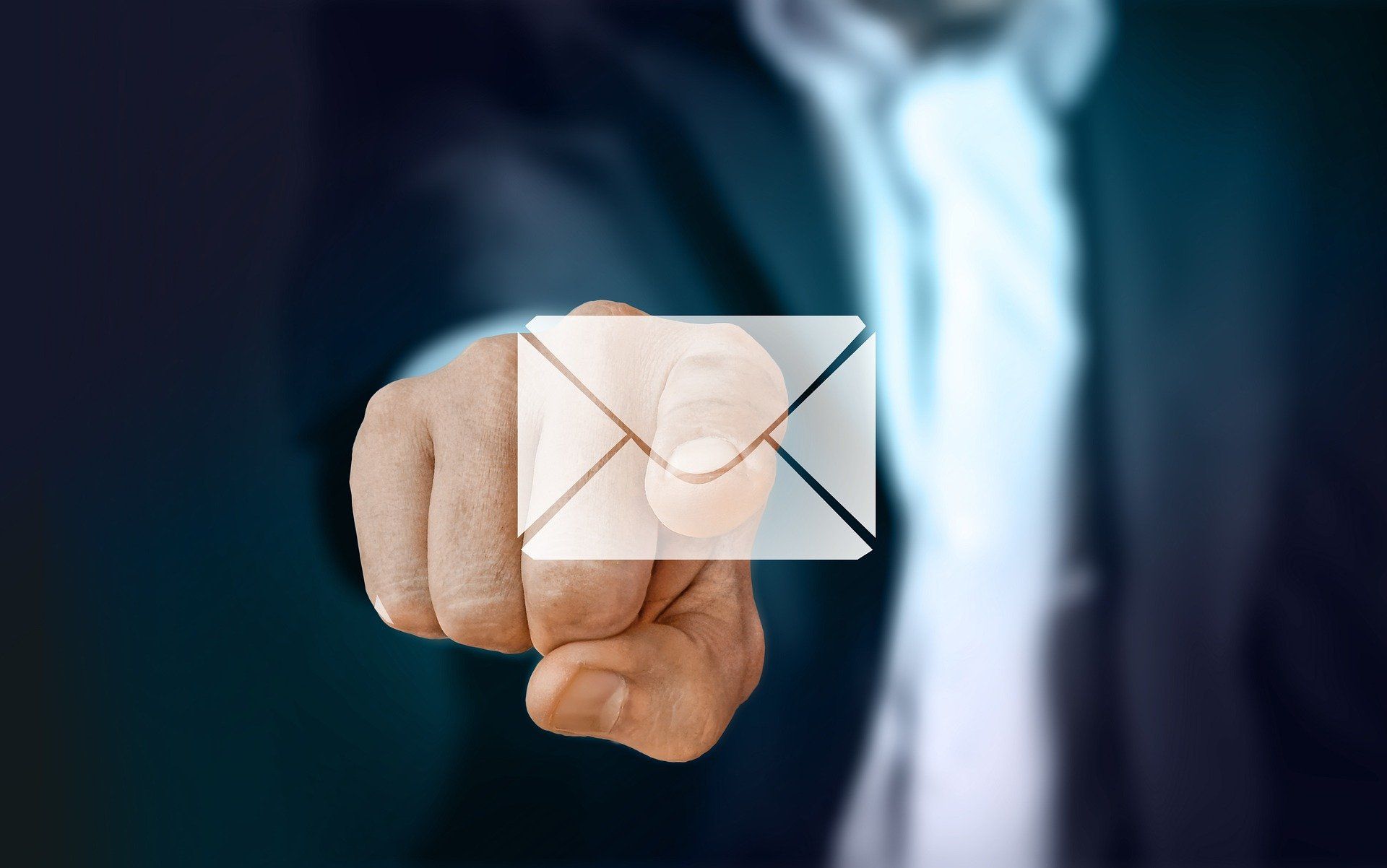 Man pointing at email icon
