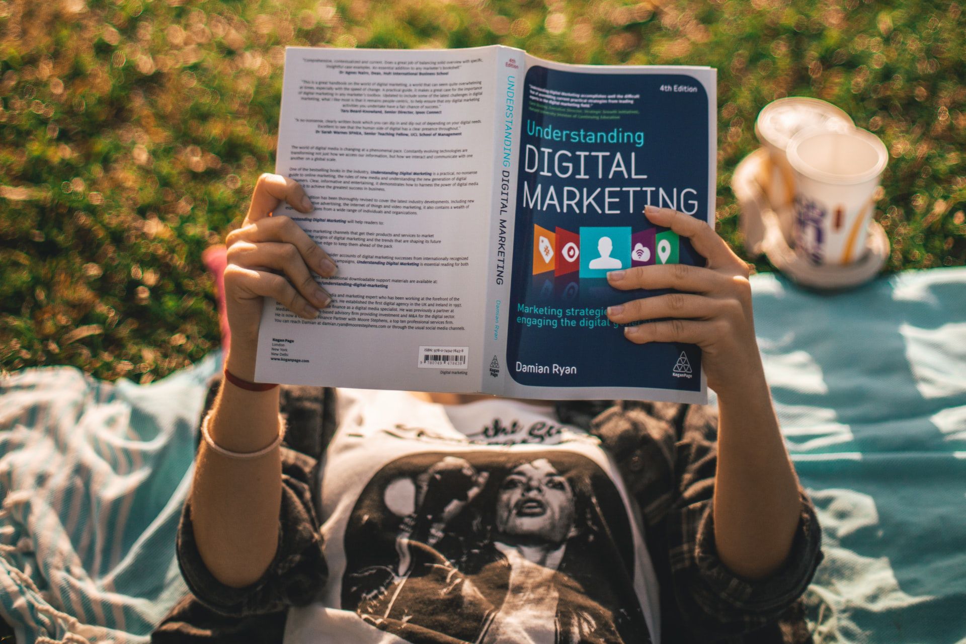 girl reading book about digital marketing
